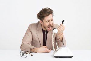 Man shouting at telephone